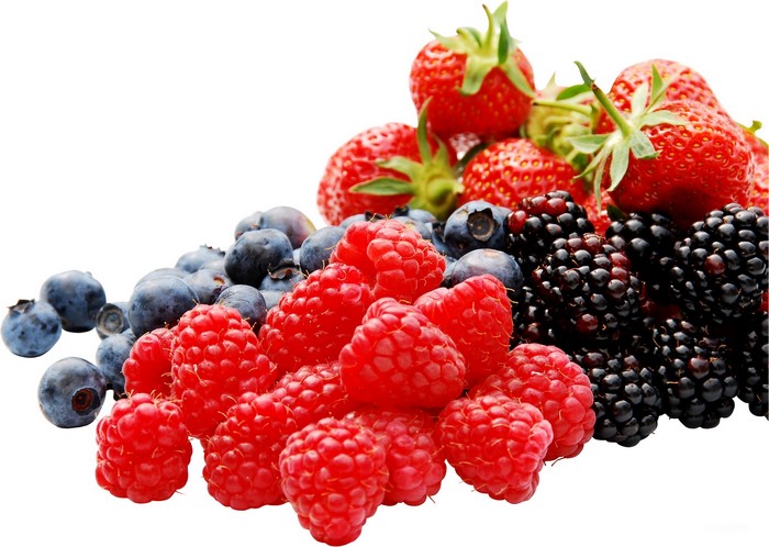 Pile of fresh berries including strawberries, blueberries, raspberries, and blackberries