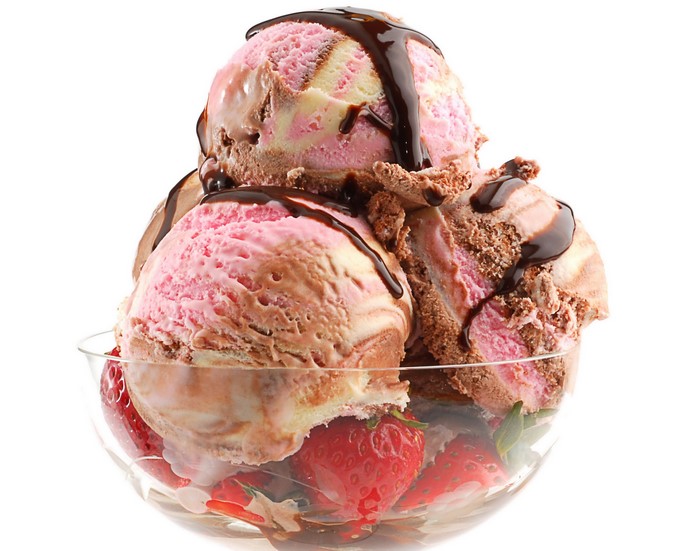Ice cream sundae with strawberries and chocolate syrup
