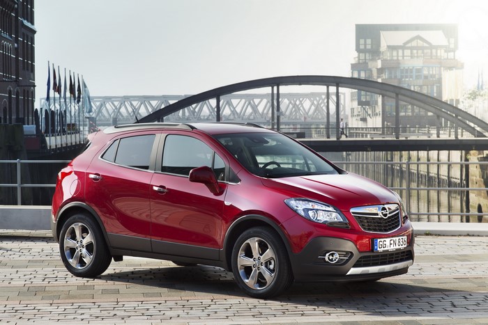 Red Opel Mokka Turbo 4x4 parked by a bridge