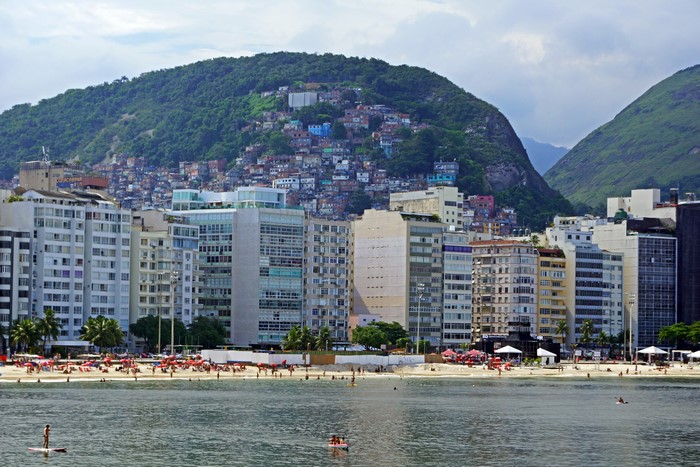 Rio de Janeiro beach with favela on mountain
