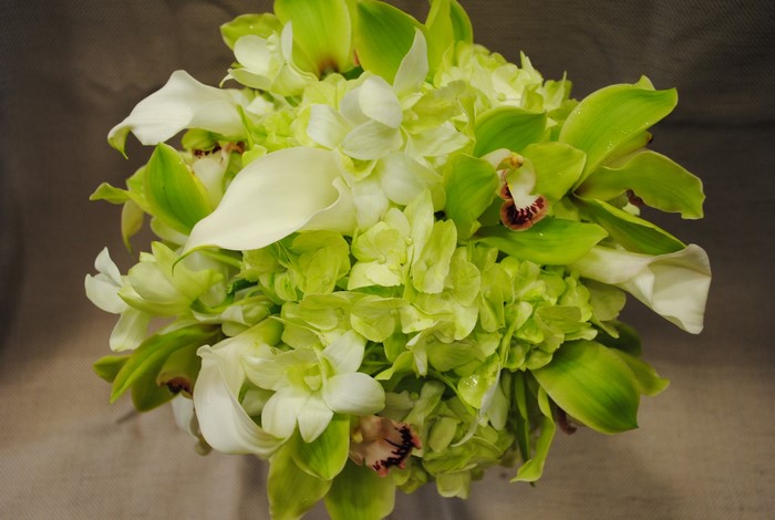 Bouquet of green orchids, white calla lilies, and hydrangeas