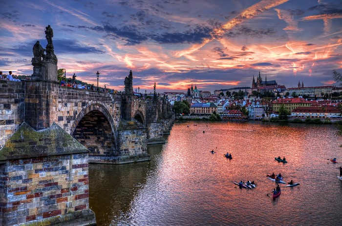 Charles Bridge and Vltava River at sunset in Prague