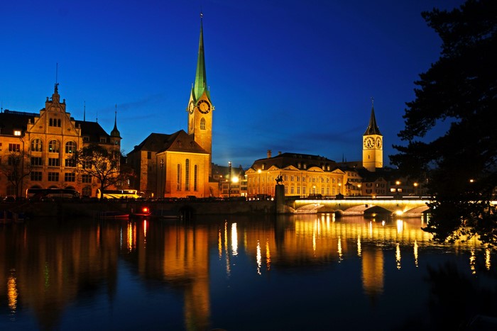 Zurich at night with river reflections