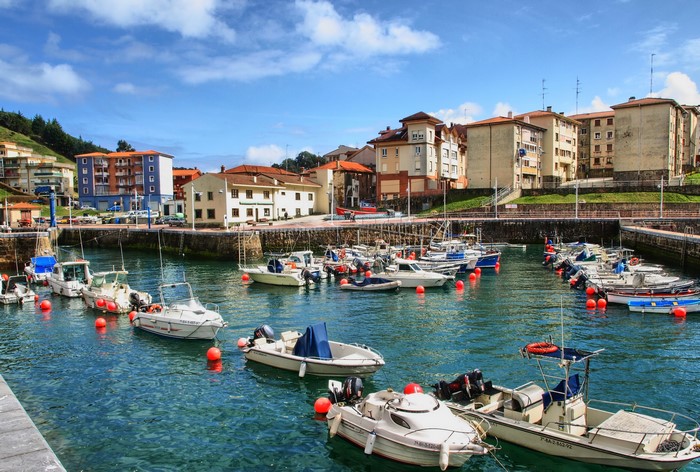 Boats docked in a harbor in the Basque Country, Spain