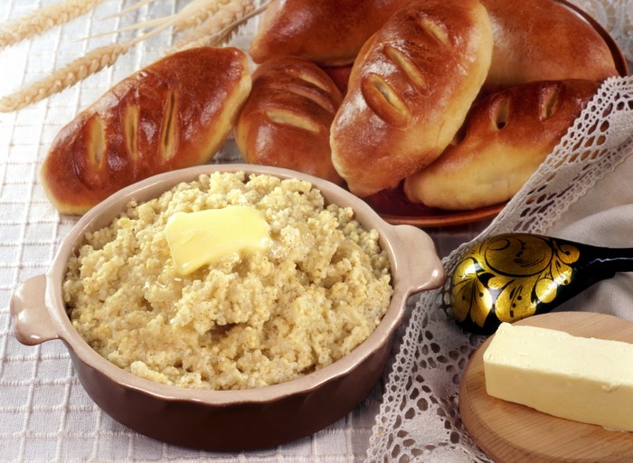 Millet porridge with butter and baked buns