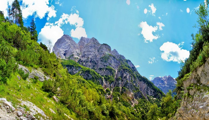 Mountain peaks in Bovec, Slovenia under a blue sky