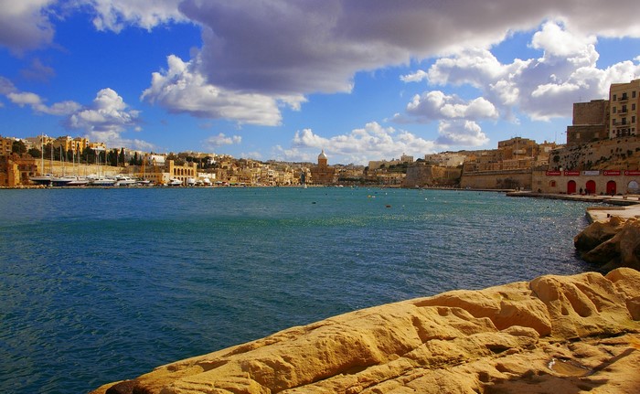 View of Kalkara, Malta waterfront with boats and buildings