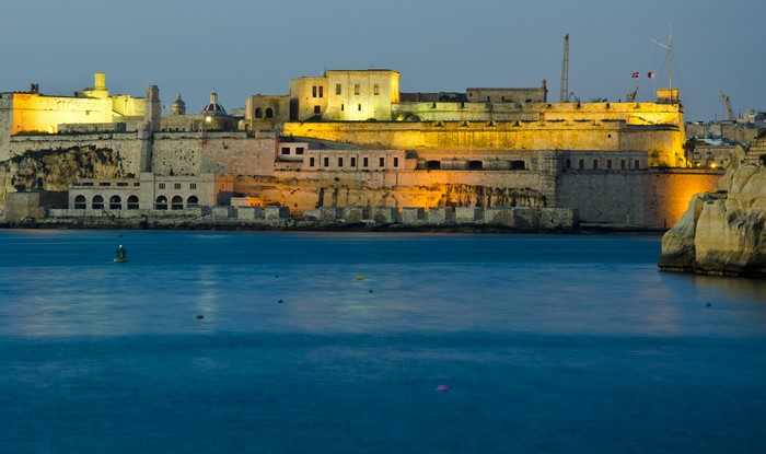 Fortifications and harbor in Kalkara, Malta at dusk