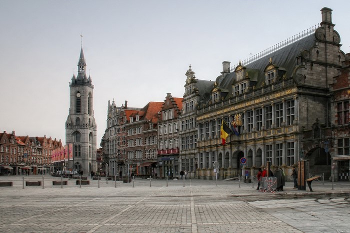 Tournai, Belgium town square with historic buildings and clock tower