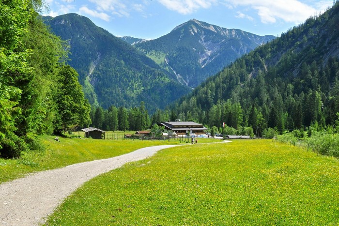 Mountain valley with a building and a path
