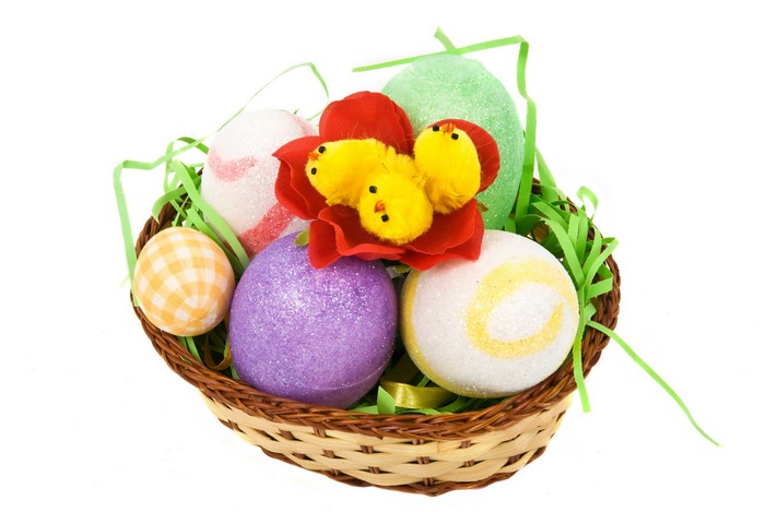 Easter basket with decorated eggs and chicks