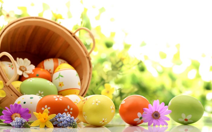 Easter Eggs in a Basket with Flowers