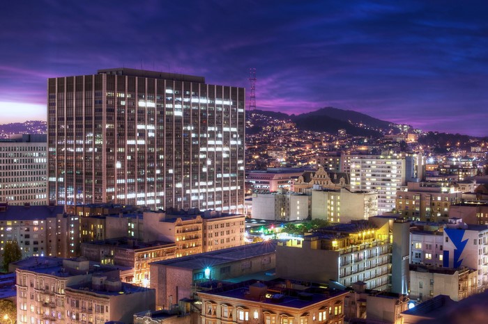 San Francisco skyline at night with mountains in background