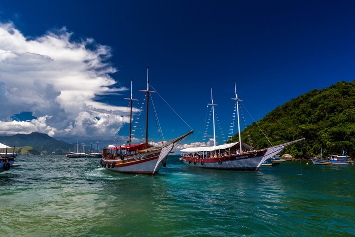 Sailing ships in Ilha Grande, Brazil under a blue sky