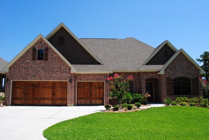 Brick house with garage and lawn