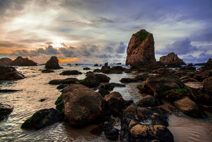 Praia da Ursa Coastline with Rocks at Sunset