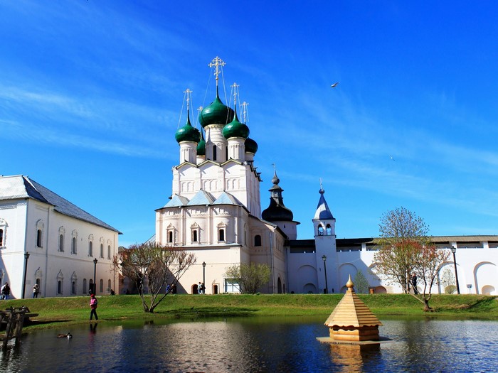Church with green domes and pond