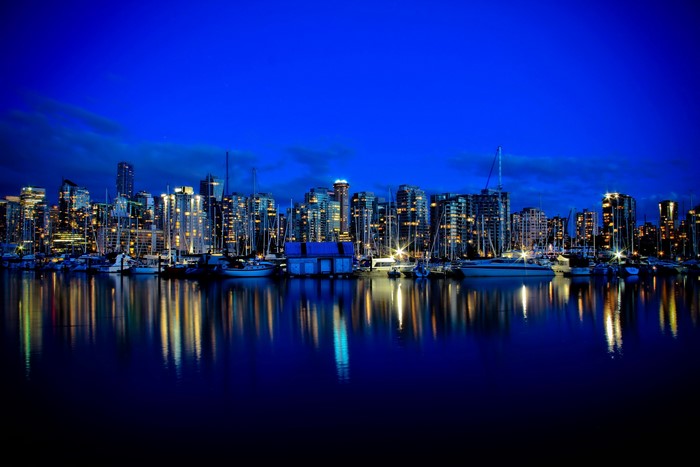 Vancouver skyline at night with reflections