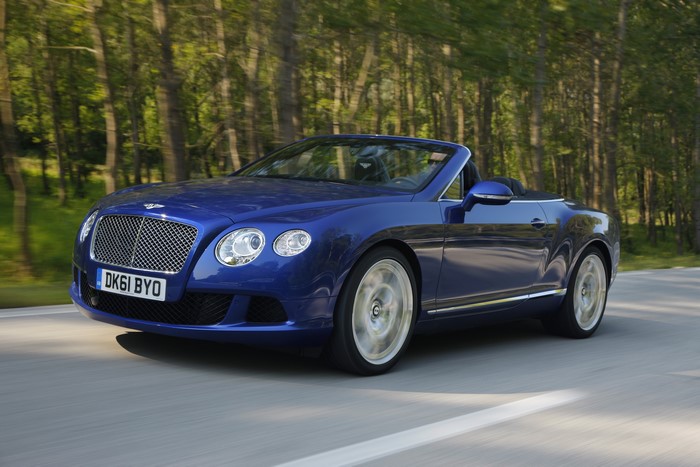 Blue Bentley Continental GTC W12 Cabriolet driving on a road