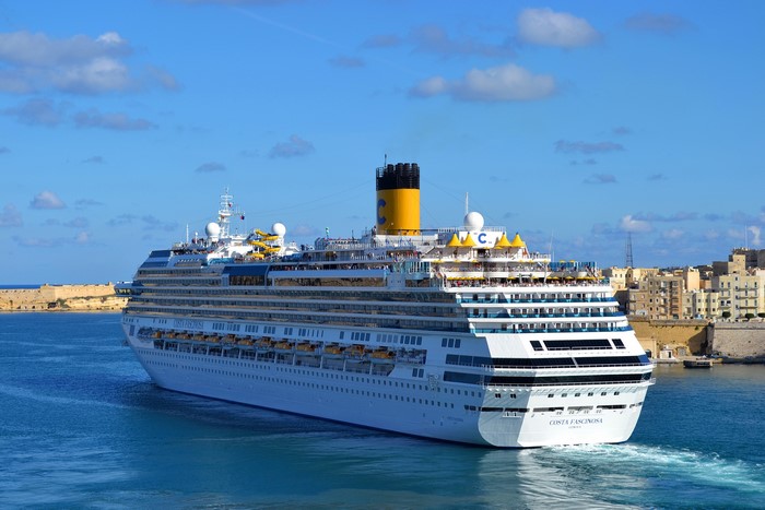 Costa Fascinosa cruise liner sailing near Malta