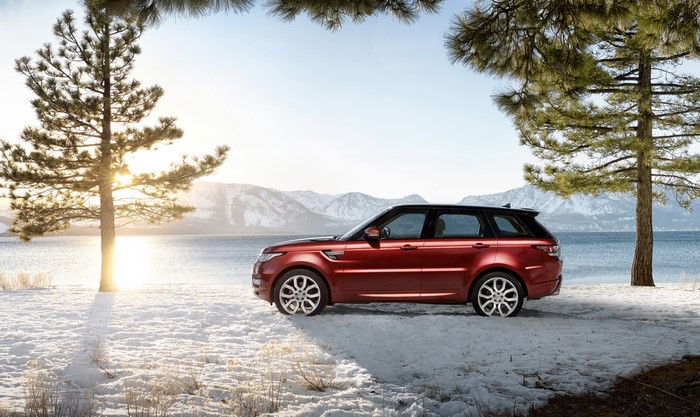 Red 2014 Range Rover Sport in Snow by Lake