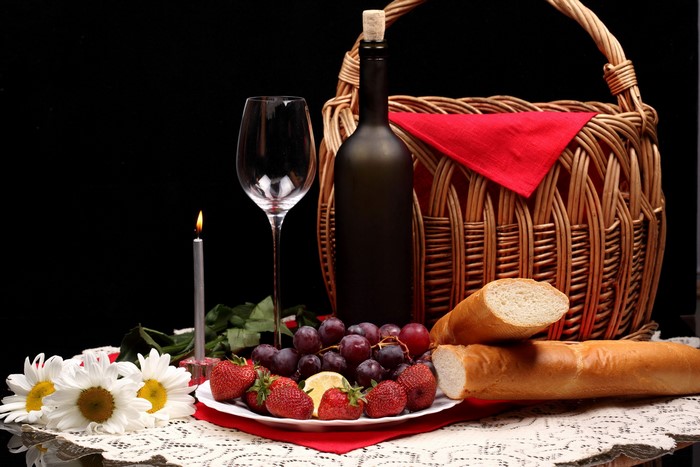 Still-life with wine, fruit, bread, and candle