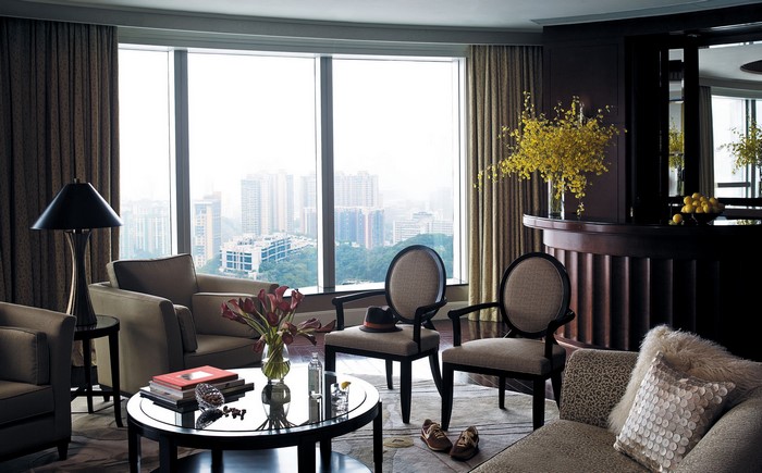Living room with large windows and city view