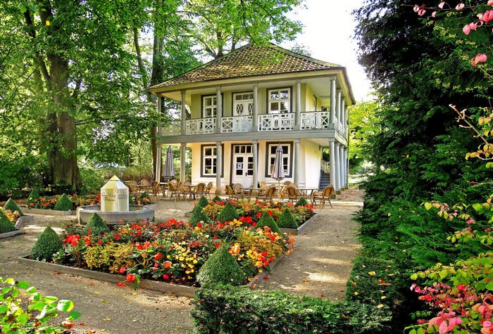 Two-story house with a garden and fountain in Germany