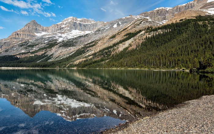 Mountains reflected in a lake in Banff National Park, Canada