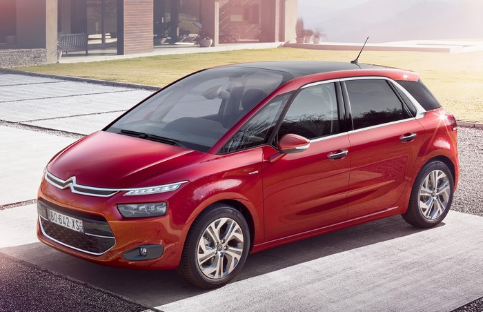 Red 2013 Citroen C4 Picasso parked outside a modern house