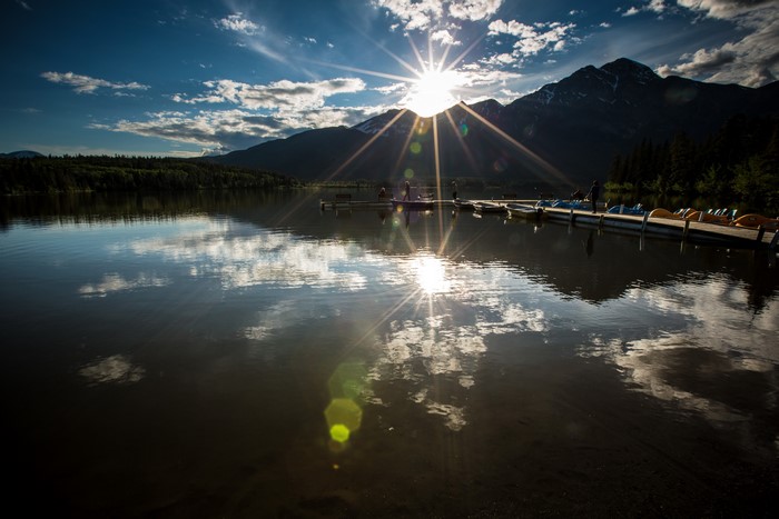 4K Mountains Scenery with Sun Rays over Lake in Canada