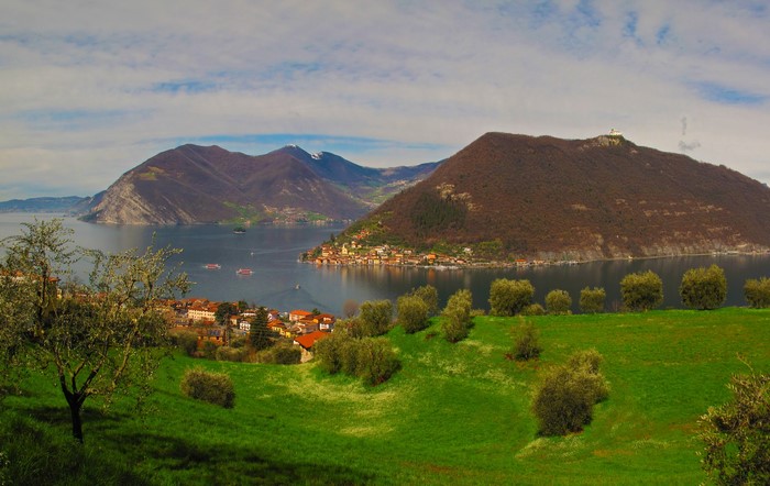 Lake Iseo with mountains and village in Lombardy, Italy