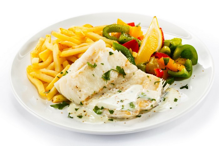 Fish with French fries and vegetables
