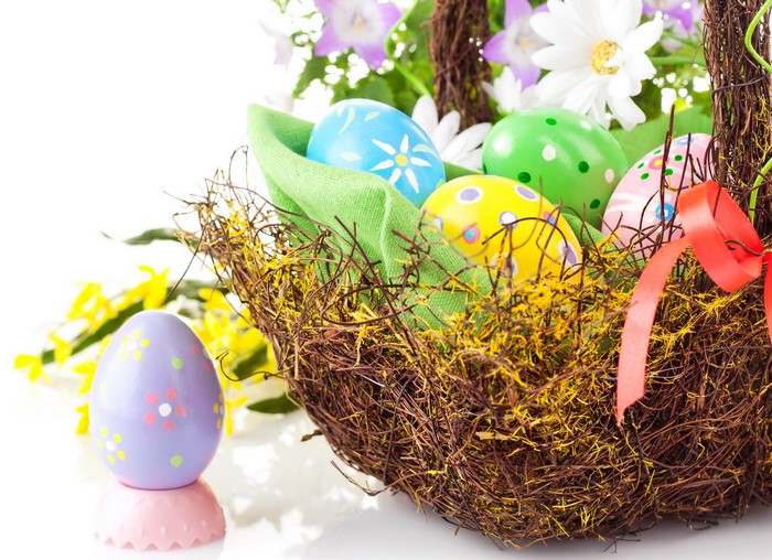 Easter eggs in a nest with flowers