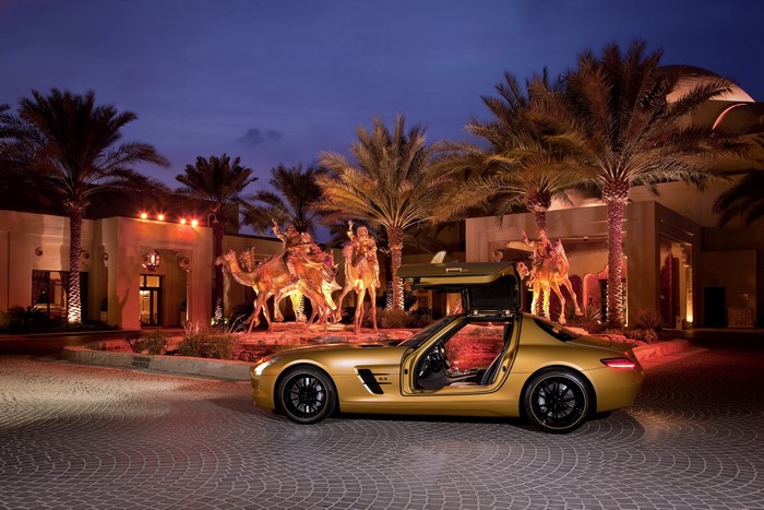 Mercedes-Benz SLS Desert Gold with Gullwing Doors at Night