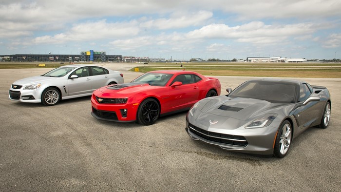 Three Chevrolet cars on a racetrack