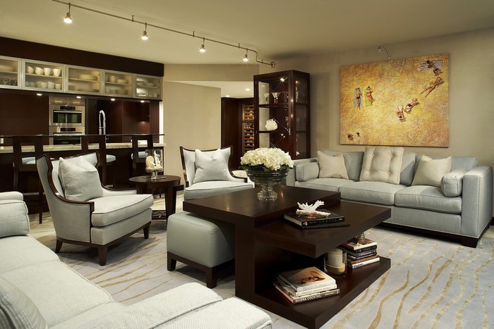 Living room with sofa, armchairs, and bar