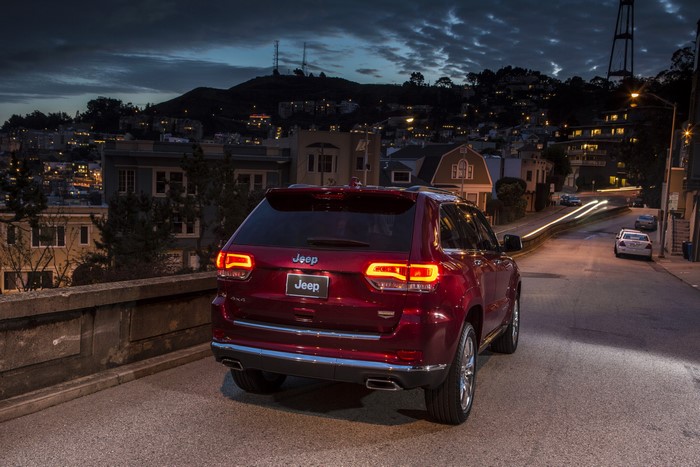 Red Jeep Grand Cherokee Summit at Night in City