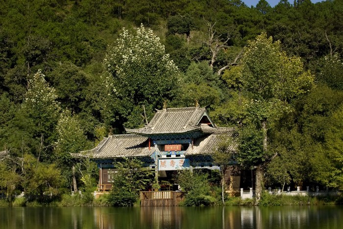 Traditional Chinese building by a lake in Lijiang, China