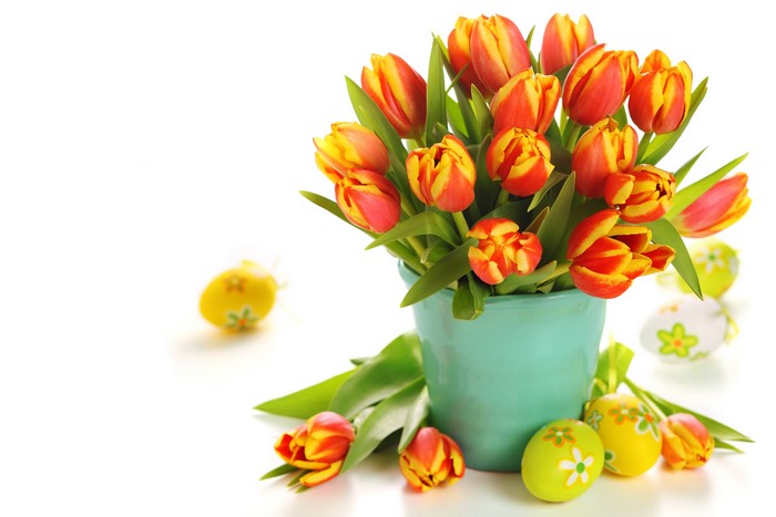 Tulips in a vase with Easter eggs
