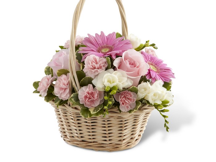 Pink and white flowers in a wicker basket