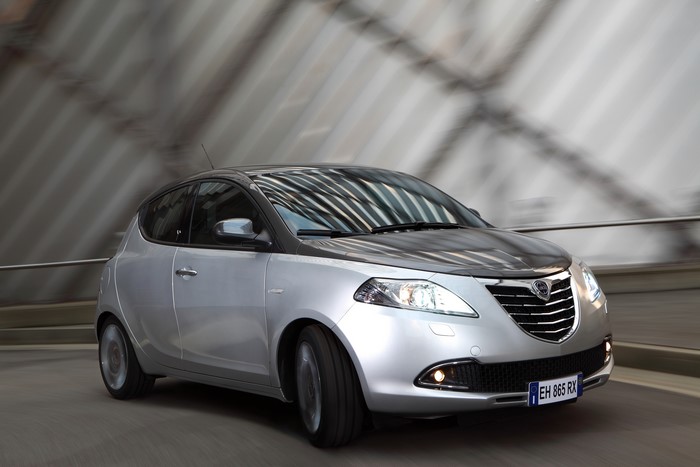 Silver Lancia Ypsilon driving on a road