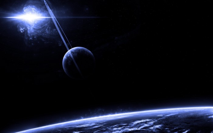 Planet with rings and bright star in deep space