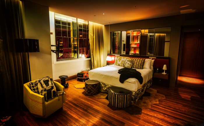 Luxury hotel room with bed and armchair