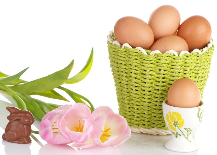 Easter Eggs in a Basket with Tulips and Chocolate Bunny
