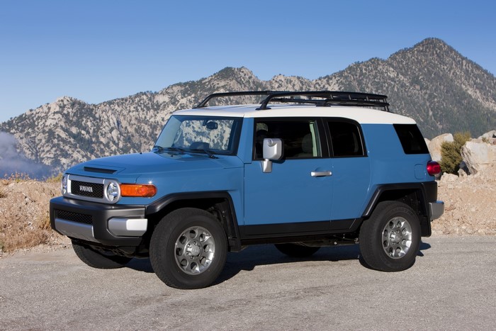 Blue 2012 Toyota FJ Cruiser parked on a mountain road