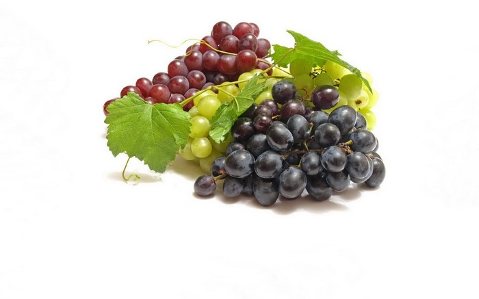 Three bunches of grapes with leaves