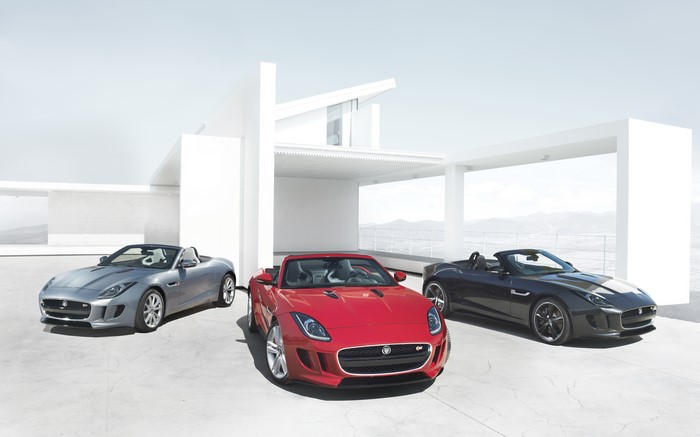 Three Jaguar F-Type Convertibles in front of modern architecture