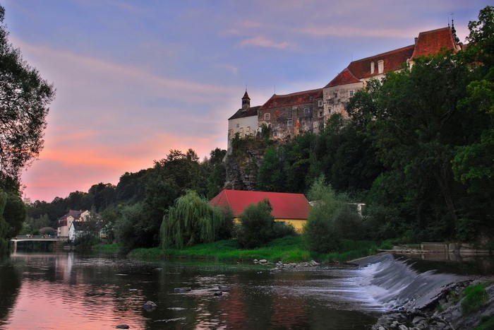 Castle above a river at sunset in Raabs, Austria