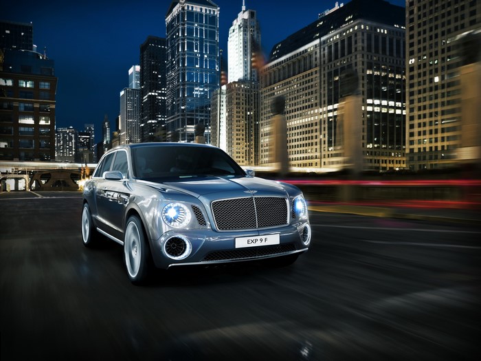 Bentley EXP 9 F luxury SUV driving in city at night